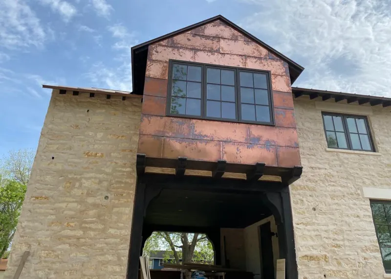 Copper metal panel facade on a stone building for Metal Roof Coating in Plainfield